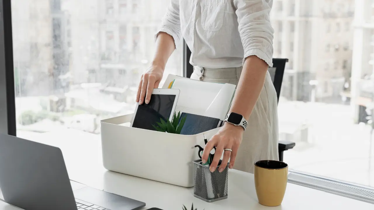 Employee packing her things because of terminations