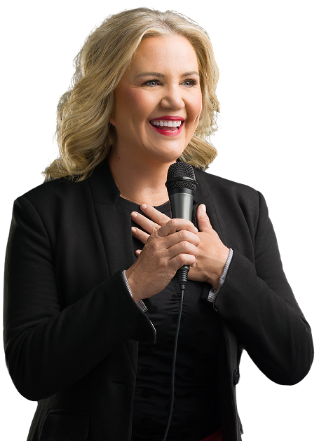 Molly, a smiling blonde woman in a black blazer, holds a microphone with both hands to her chest.