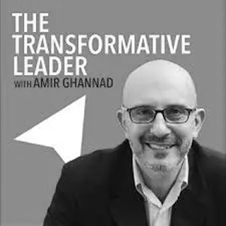 "The Transformative Leader with Amir Ghannad" — a smiling bald man with glasses and a beard beside a white arrow graphic on gray.